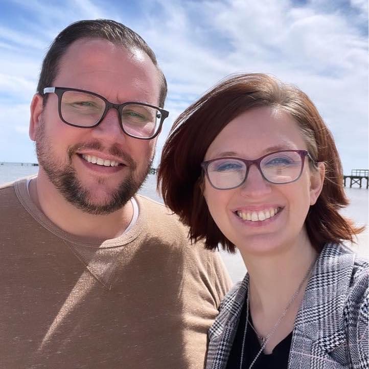 A photo of ADA Check founders Tabitha and Justin Brooks enjoying a beach scene from coastal Mississippi. 